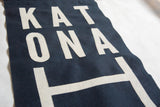Hand-cut cream felt letters on navy Katonah banner showcasing unique arrangement.