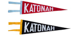 Vintage style black felt Katonah pennant, white letters, yellow trim, next to a red pennant.