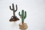 Handmade light green speckled ceramic cactus jewelry holder with rings.
