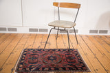 Antique Lilihan rug's raspberry red field, center medallion, and expressive sickle leaf motifs.