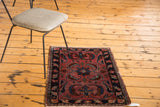 Antique Persian Lilihan rug mat: raspberry red field, expressive leaves, subtle edge wear.