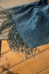 Collectible vintage indigo textile with fringed edge and unique hand woven texture.