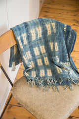 Textured detail of vintage Batik Indigo Throw, showing fringed edge and hand-stitched repair.