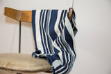 Vintage indigo throw with hand-woven deep blue and off-white vertical stripes.