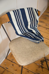 Vintage hand-woven Indigo Throw displaying rich blue and cream vertical stripes.