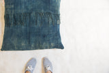 Vintage African Indigo floor pillow with unique hand-dyed texture and intact fringe.