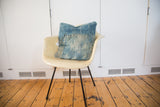 Sun-faded blue tones and texture of the African Indigo throw pillow.