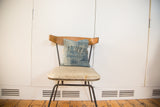 Vintage African Indigo pillow featuring sun-faded blue texture and frayed top edge.