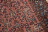 Worn texture of distressed antique Malayer rug, with raspberry red and indigo Herati pattern.