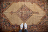 Time-softened Persian Hamadan rug, highlighting its serrated diamond medallion and rich, varied colors.
