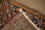 Distressed vintage Hamadan rug showing hand-knotted foundation, fringed edge, and traditional motifs.