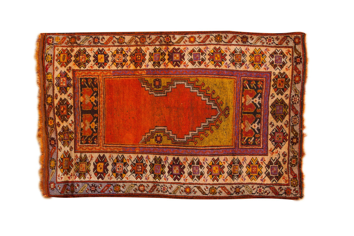 Hand-knotted vintage Oushak prayer rug in brilliant tangerine orange, mustard yellow, geometric borders.