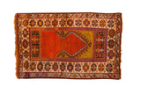 Hand-knotted vintage Oushak prayer rug in brilliant tangerine orange, mustard yellow, geometric borders.