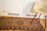 Finely woven Malayer rug, traditional geometric tendrils and blossoming flowers.