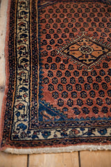 Corner view of a vintage Engelas rug featuring a geometric medallion and intricately patterned border.