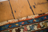 Distressed Hamadan rug edge with tattered fringe and colorful border design.