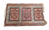 Antique Caucasian geometric rug with madder red, sky blue, and ivory tribal medallions. 1'10