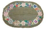 Early 20th century American hooked rug, olive green oval with vibrant bohemian floral border, 2'3