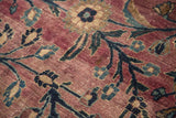 Curvilinear plum, navy, and ivory floral patterns on this vintage Persian Meshed carpet.
