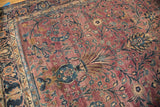 Vintage Meshed rug showing plum field, delicate floral tendrils, and Classic Safavid border.