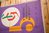 Lower right poster corner showing 'VP' initials, black staff lines, and linen mounting.