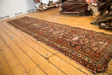 Distressed antique Northwest Persian runner, Herati floral design in faded brick red, indigo.