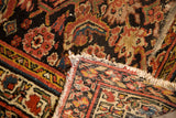 Distressed antique Persian runner's intricate Herati floral pattern, short fringe, and visible woven foundation.