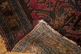 Lilihan rug's ruby rose pile, teal floral patterns, woven foundation, and tattered fringe.
