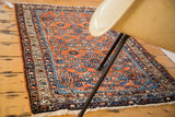 Vintage Hamadan rug field detail: traditional red rust Herati pattern, blue, green, ivory.