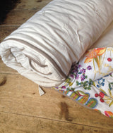 Handmade Kids Sleeping Bag, light brown cotton outer, colorful white floral inner.