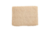 Plush Moroccan shag bath mat in a soft, light beige color, 2'1