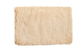 Plush hand woven Moroccan shag bath mat in a neutral light beige, 2' x 3'.
