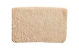 Plush hand woven Moroccan Shag bath mat with light beige shaggy texture, 2' x 3'2