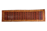 Antique Malayer hand-knotted runner rug with repeating geometric patterns in ruby red and indigo blue, 3'x10'.