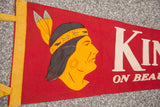 Vintage red felt banner with yellow feathers and green animal motifs.