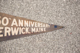 Vintage Berwick, Maine felt flag banner's faded brown pointed end with blue dot.
