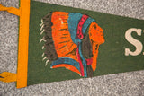 Close-up of the vintage green felt flag, showing yellow binding and aged texture.