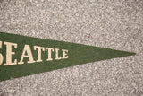 Pointed end of the vintage green felt banner, showing cream 'TTLE' lettering.