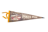 Faded vintage Pikes Peak felt flag with Summit House illustration and gold ties, 5.5x18 inches.