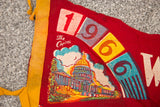 Red felt 1966 Washington DC flag detail, showing Capitol building and colorful date blocks.