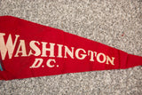 Red felt 1966 Washington D.C. flag, showing worn white lettering and texture.