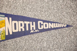 Detail of vintage blue felt North Conway NH banner with cream lettering.