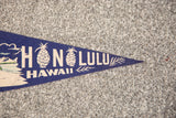 Cream 'LULU' text and pineapple graphic on navy blue felt Honolulu flag tip.