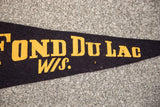 Aged yellow FOND Du LAC W/S. lettering on vintage dark blue felt flag.