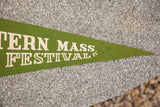 Close-up of vintage green felt flag's pointed tip with white 'MASS. FESTIVAL' text.