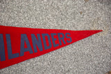 Red felt flag banner with partial dark blue LANDERS lettering and pointed end.