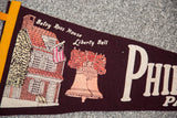 Vintage maroon felt Philadelphia flag with Betsy Ross House, Liberty Bell, 'Phi'.