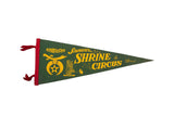 Vintage Shrine Circus souvenir pennant in green felt with yellow graphics and a red spine.