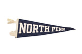 Vintage North Penn felt flag banner in dark blue with cream lettering. 8x22.5 inches.