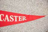 Pointed end of the vintage red felt Lancaster PA flag banner with cream lettering.